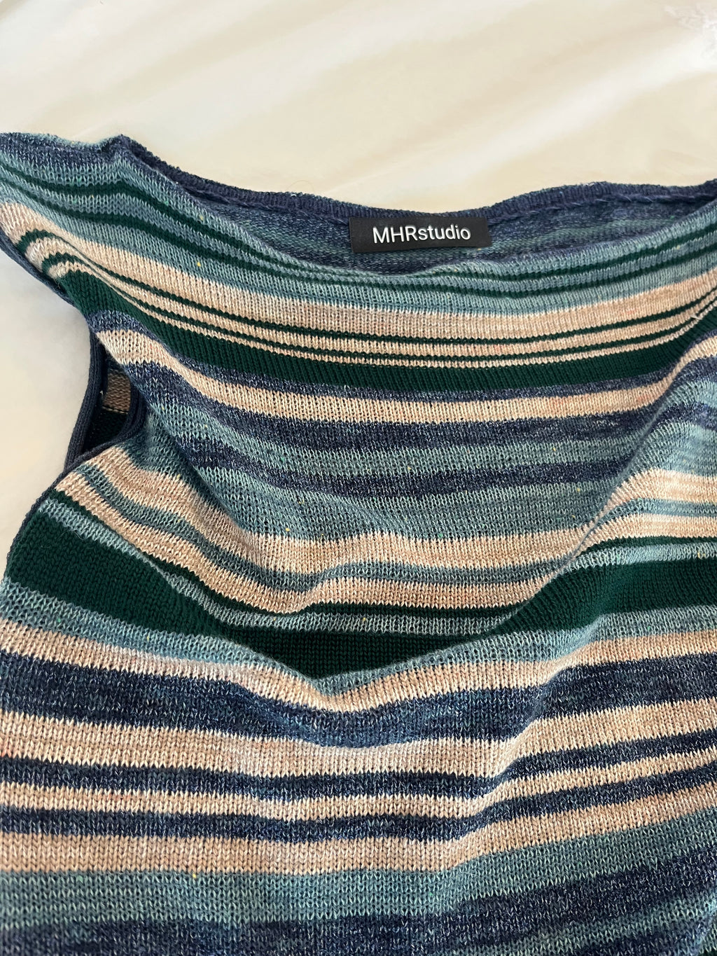 Asymmetric striped top